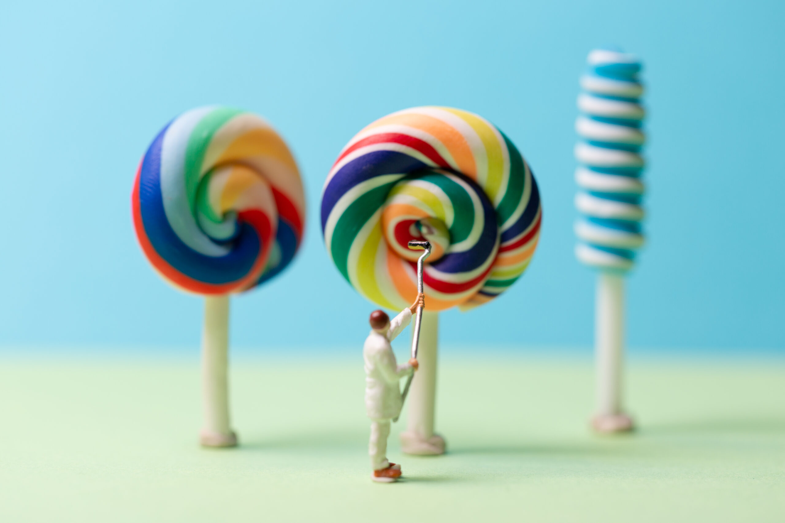 macrophotography of person cleaning a giant lolly
