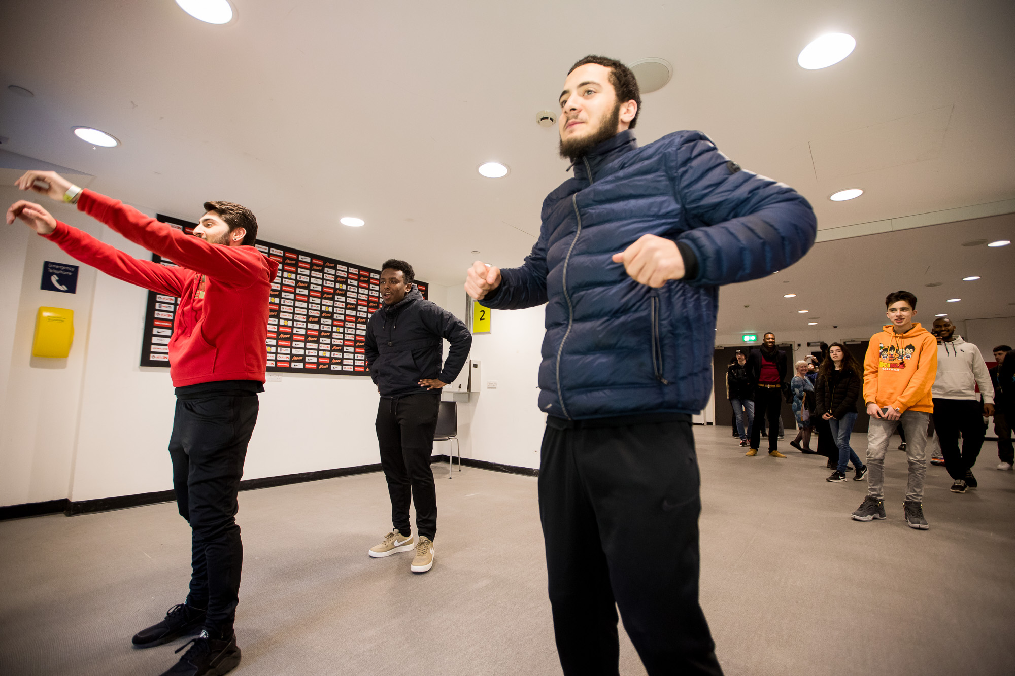 Students exercising before their creative workshop to play more and work better