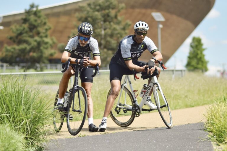 Adisa and Paul the Dynamic Duo training for RideLondon posing for a photoshoot to support The Manifesto and to Raise Funds