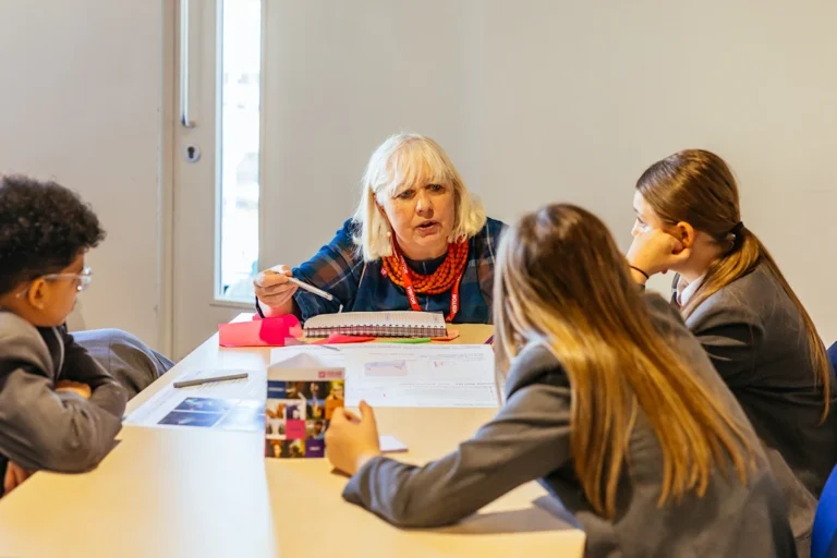 Heather MacRae (photographed with students)